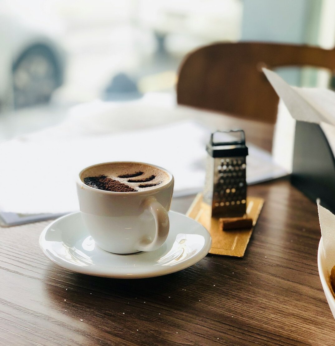 Financial advisor desk with laptop and coffee