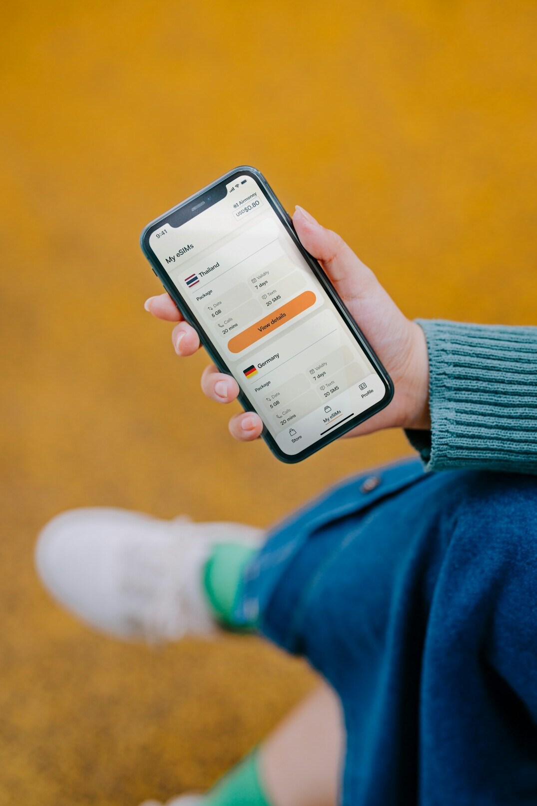 person using financial app on phone