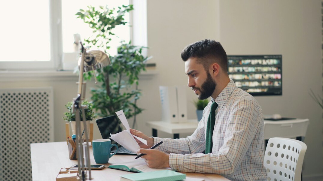 person reviewing finances at desk