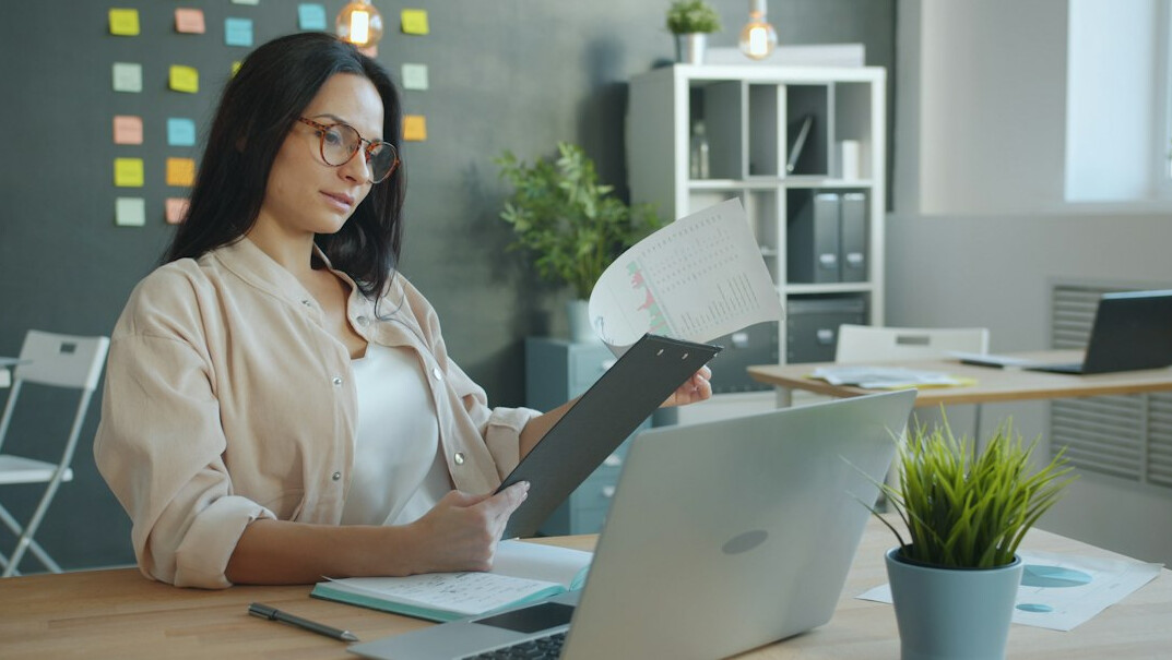 woman reviewing finances at desk