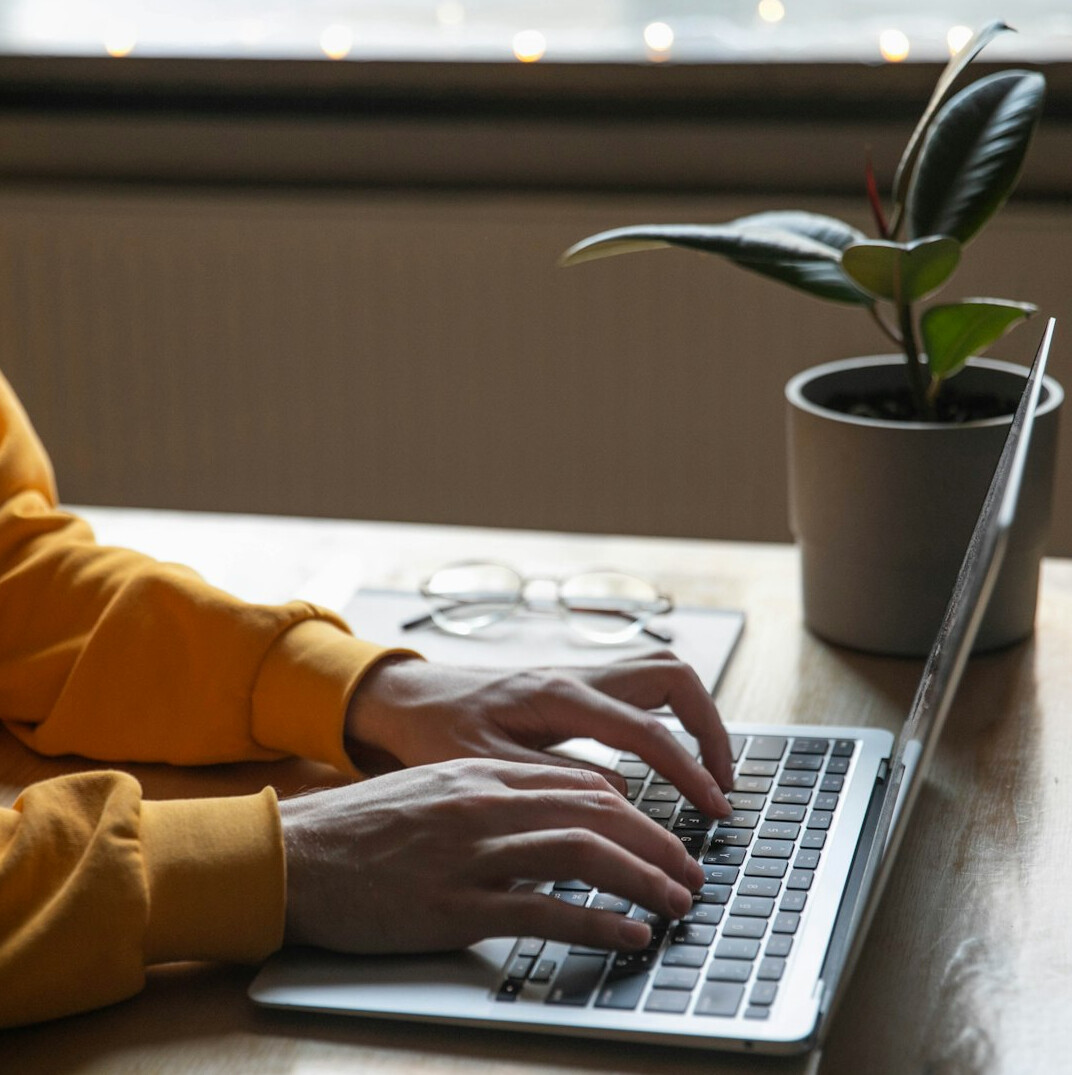 person using laptop for budgeting