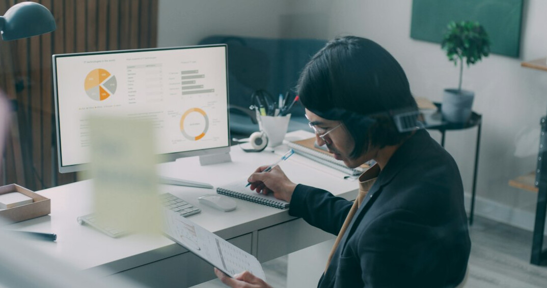 person reviewing bills at desk