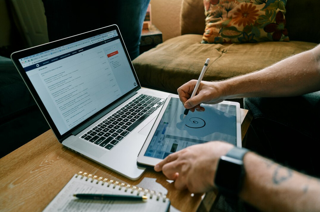 person using laptop for budgeting
