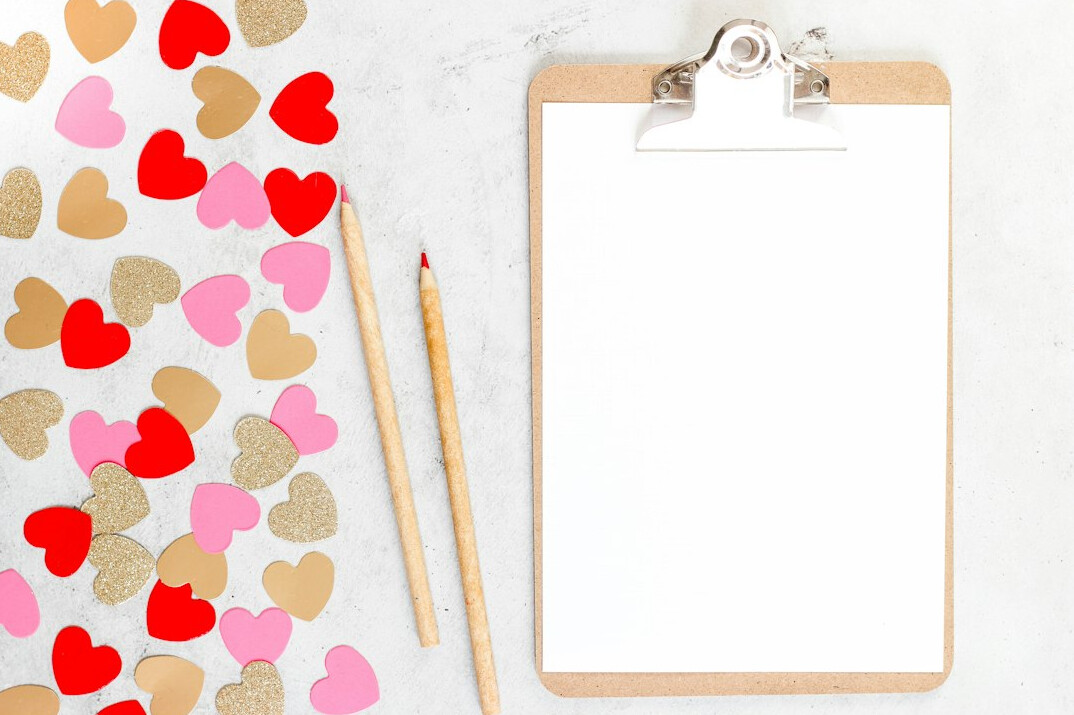 Checklist on clipboard with a pen